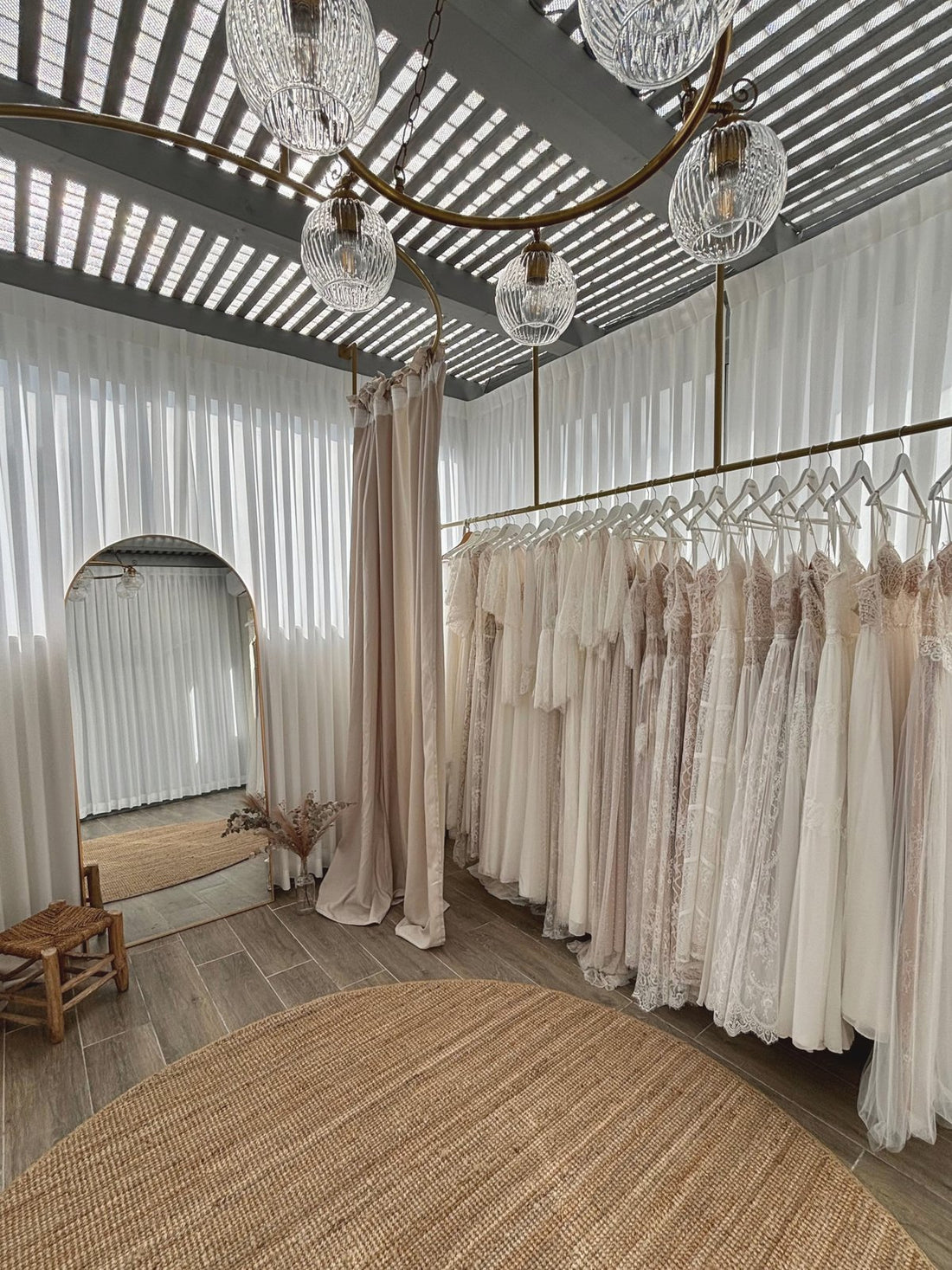 Lace & Love boho bridal studio with a rack of made-to-measure wedding dresses, an alternative to a traditional boutique