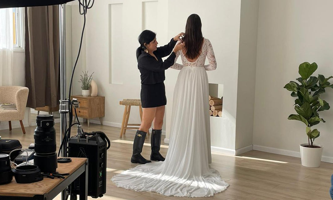 Designer Shany Sasson fitting a bride in the Lace & Love boho bridal studio