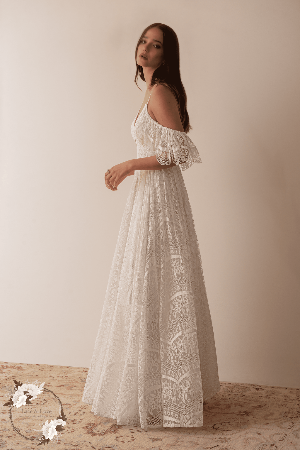 Side view of a boho lace bridal dress with soft movement