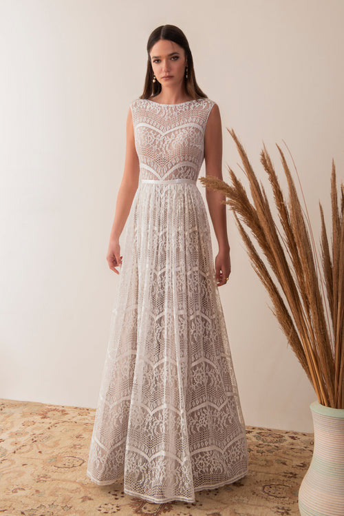 Full front view of a boho lace wedding dress with sleeveless bodice