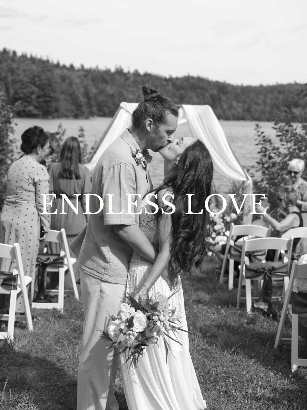 Elise Gown, Chiffon & Lace Beach Wedding Dress, Made to Measure, worn by a bride in a wedding photograph with her partner