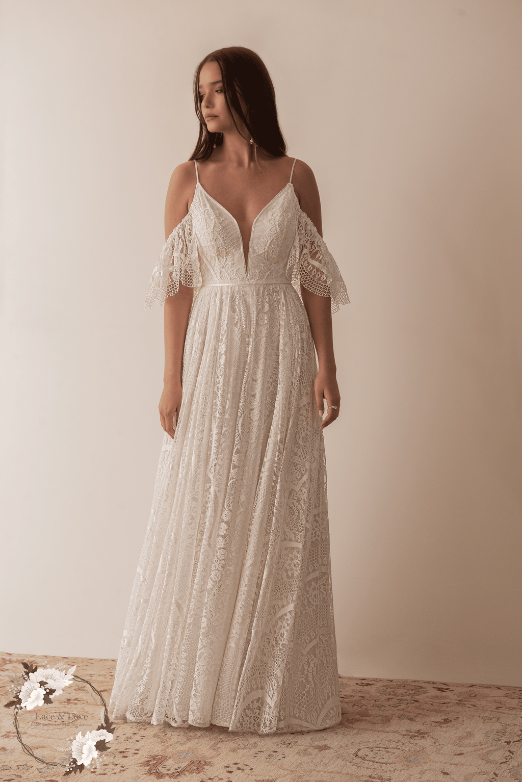Off shoulder boho lace bridal gown with romantic flowing skirt