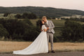 Real bride wearing a boho tulle wedding dress in a countryside wedding