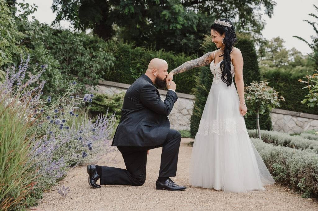 Real bride in a boho lace wedding dress during a garden wedding moment