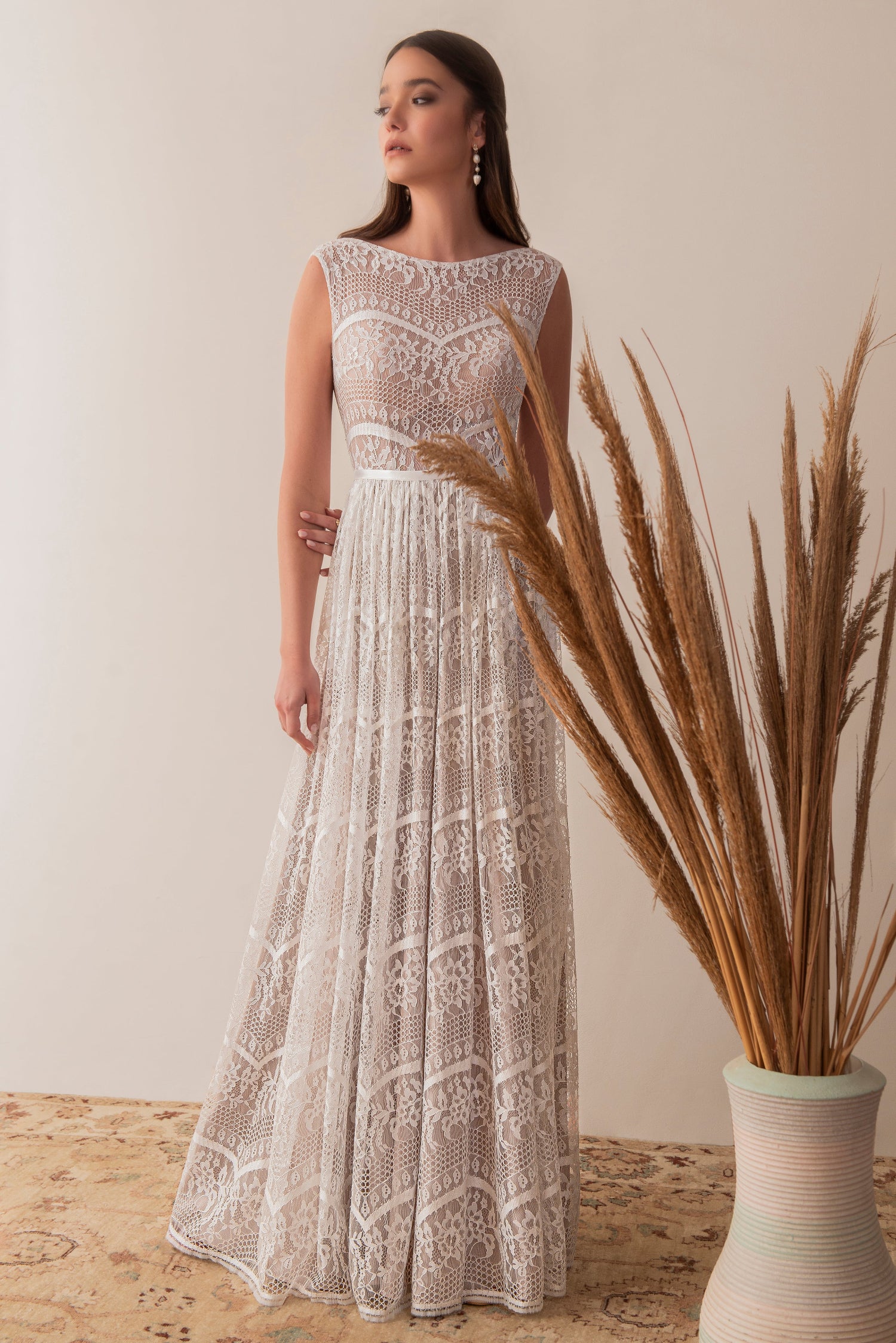 Sleeveless boho lace bridal gown with romantic full length silhouette