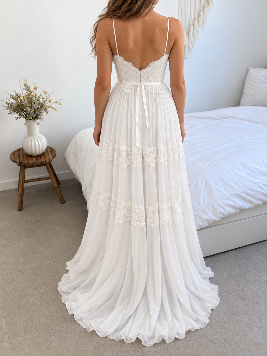 Sophie Gown, back view of the boho lace and chiffon wedding dress with open back, bow belt and flowing train