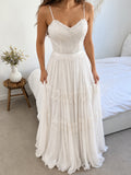 Sophie Gown, bride holding the flowing chiffon skirt with sewn-on lace bands