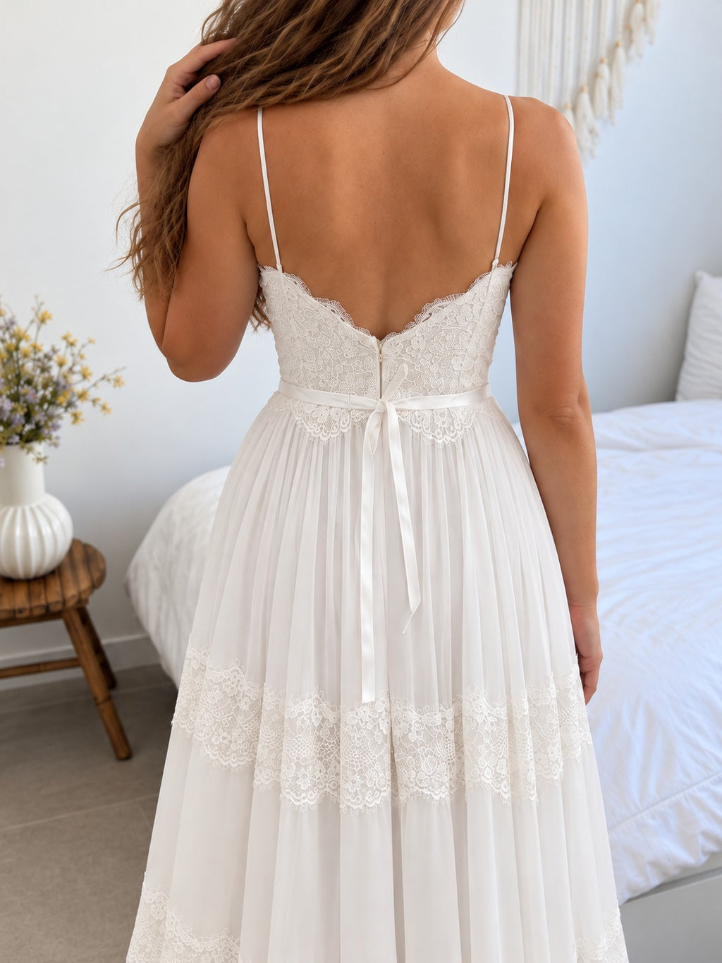 Sophie Gown, close-up of the open back, sweetheart lace bodice and bow belt
